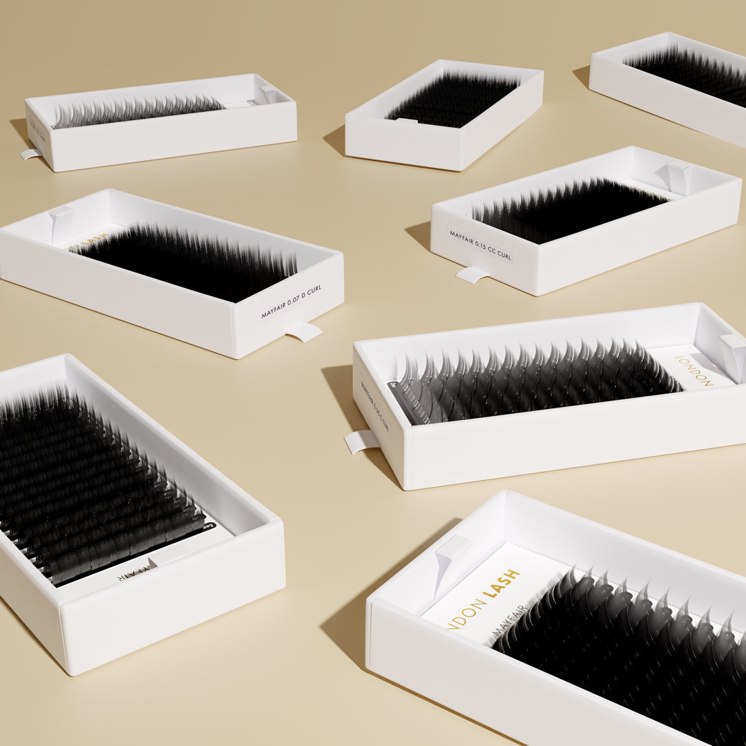 large carton box filled with many lash extension trays