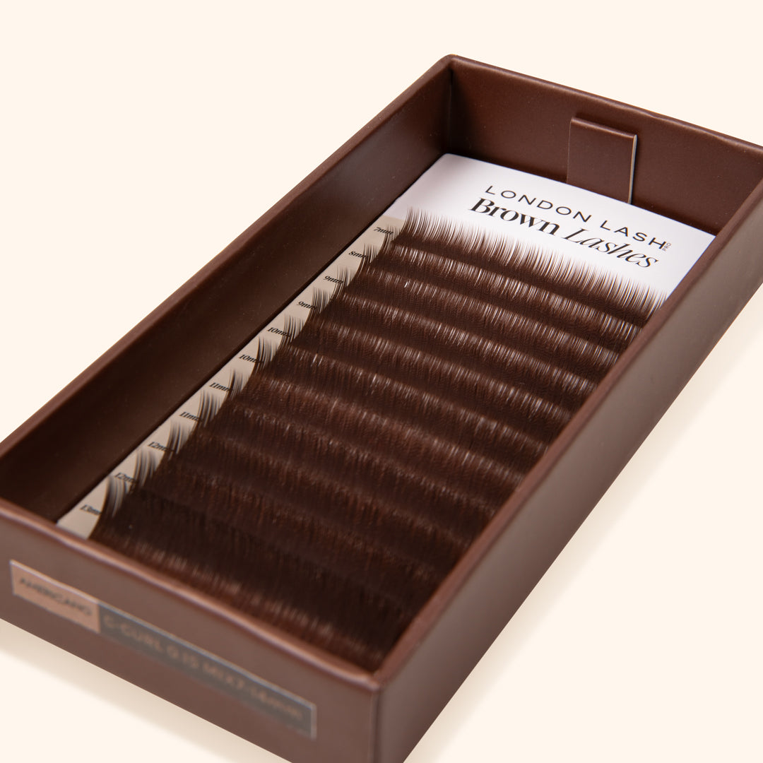 open lash tray with lash card with medium brown synthetic eyelash extensions