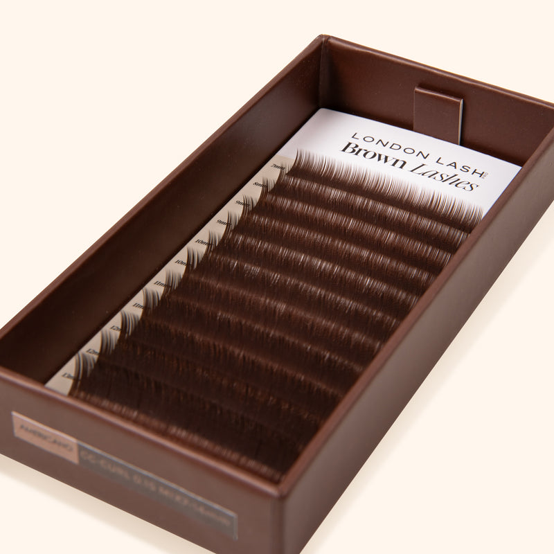 brown carton lash tray with mixed lenght dark brown mink eyelash extensions inside