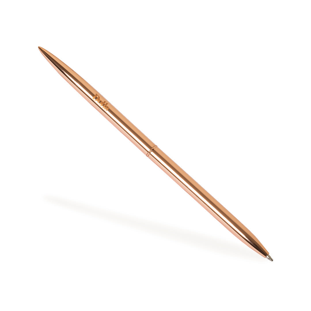 rose gold metallic ballpoint thin pen on white background