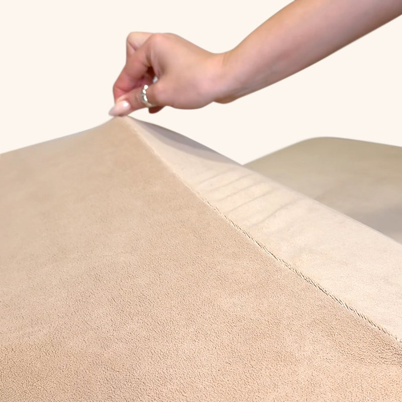 Woman touching a soft teddy bear bed cover