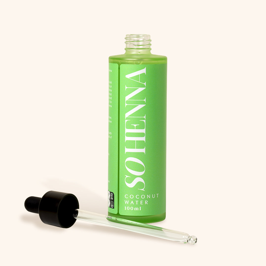 opened green 100ml bottle of henna remover with a pipet on the side