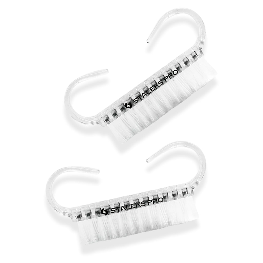 transparent plastic Staleks Manicure Brushes for Dust Removal with white fibers on the white background