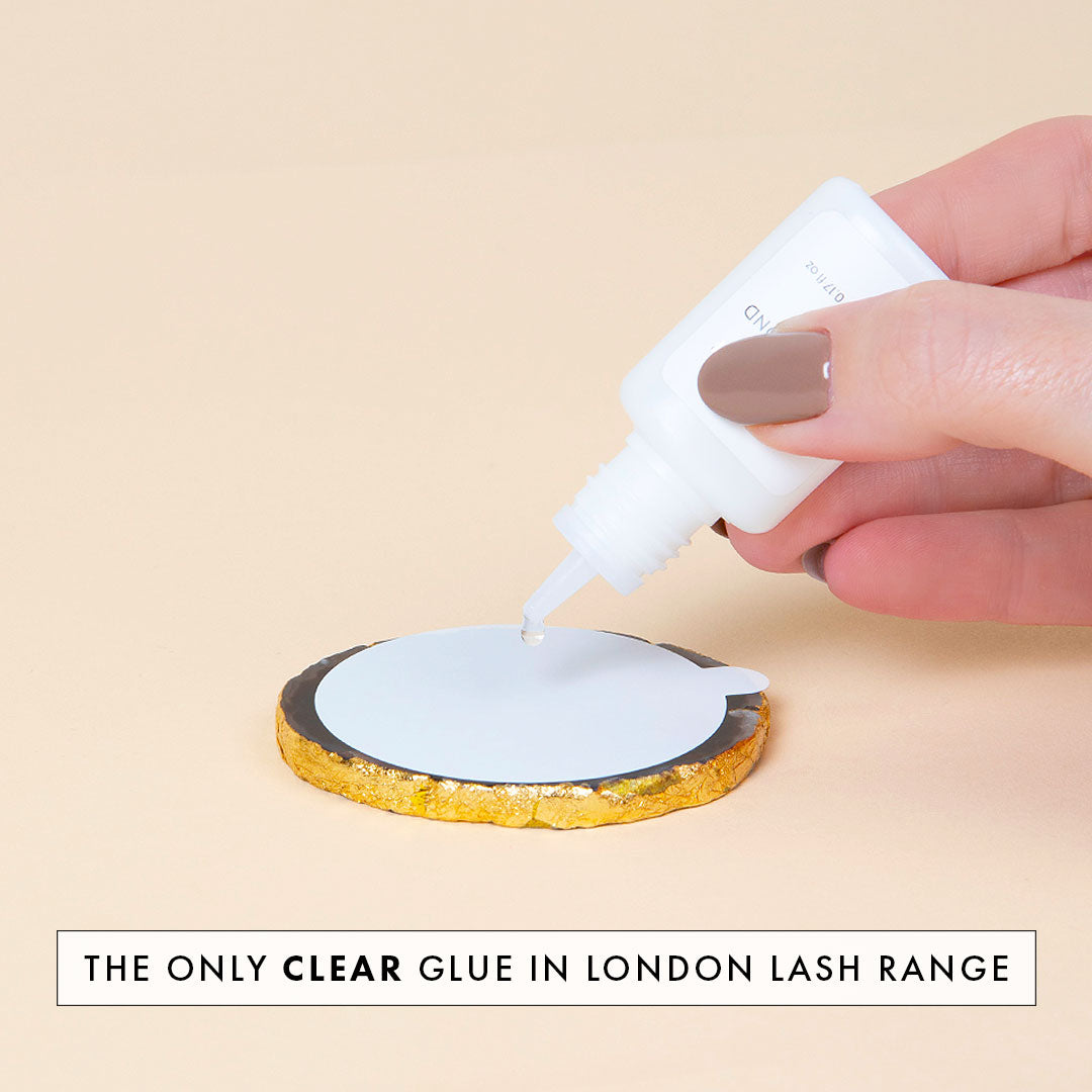 crystal bond clear lash extension glue being dispensed onto a jade stone, Crystal Bond Eyelash Extension Glue, London Lash Glue, best lash extension glue, london lash pro glue, london lash glue, lash adhesive, london lash adhesive, eyelash extension glue,